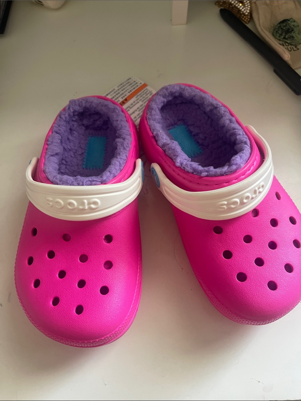 CROCS Kids Fuzzy-Lined Clog in Hot Pink with Purple Lining and White Strap